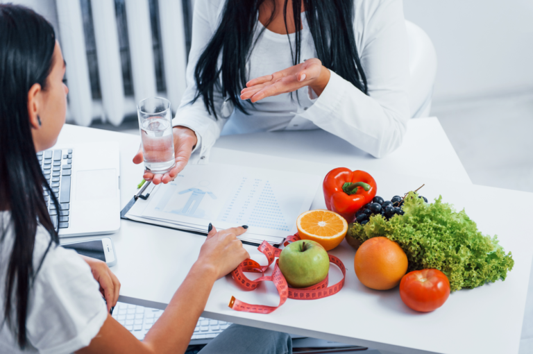 Female nutritionist gives consultation to patient