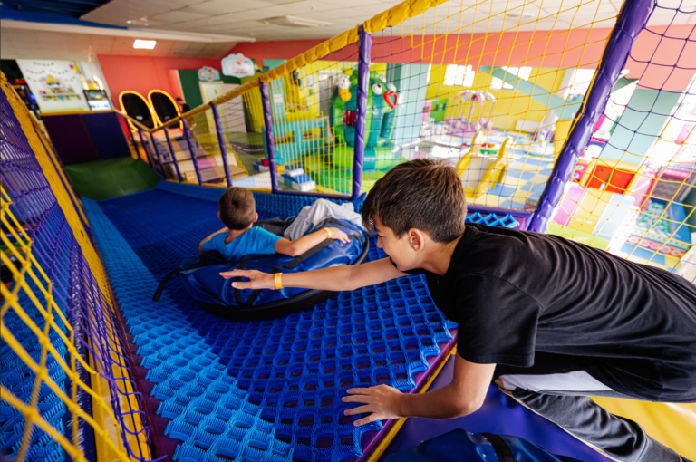 Kids playing at indoor play center playground